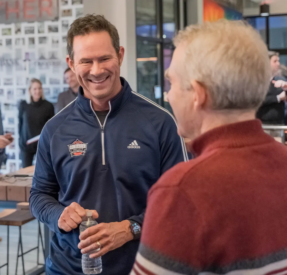 Brett Payne meeting with a business owner